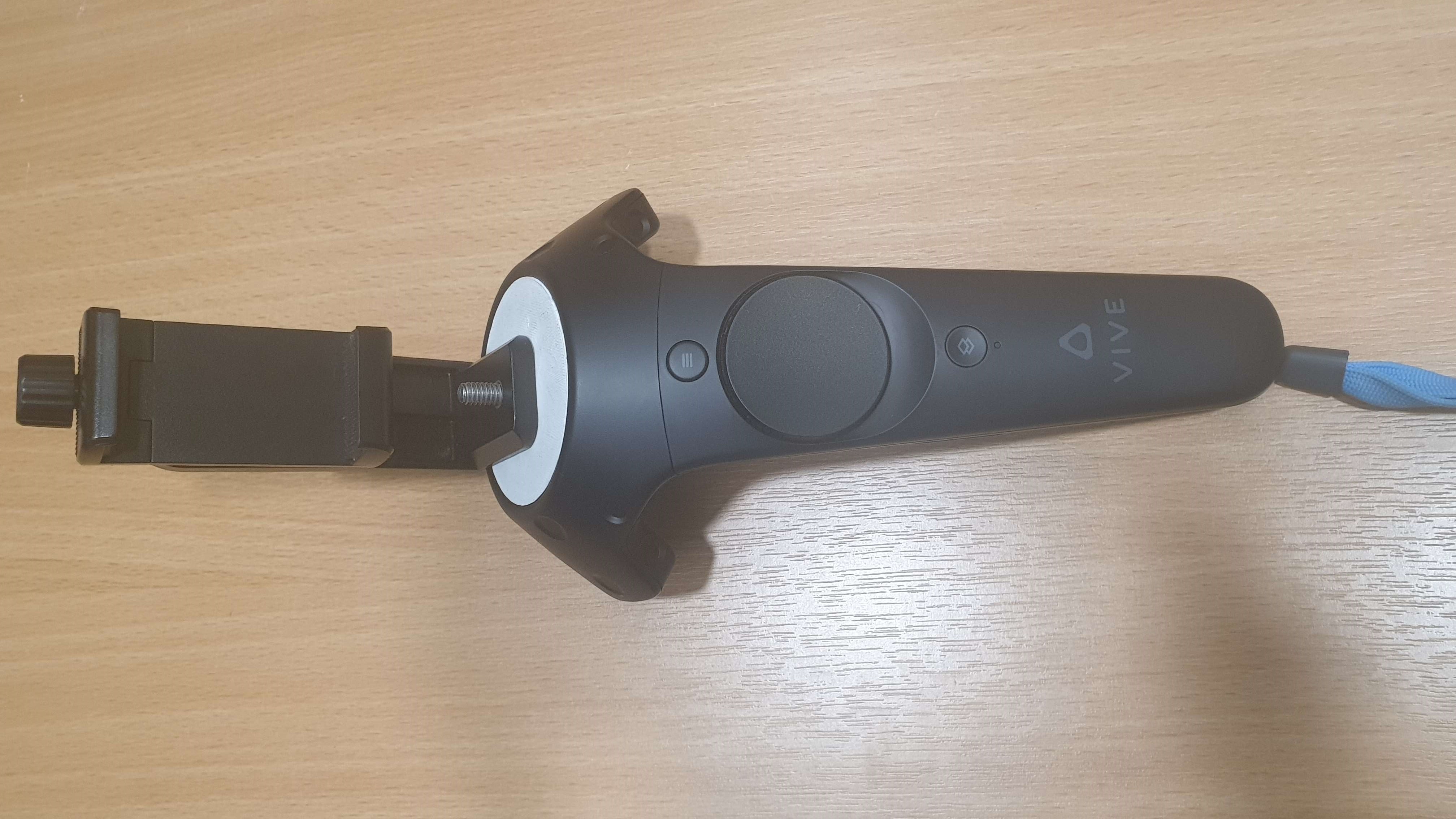The phone holder mounted on the HTC Vive controller